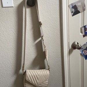 A cream on the shoulder purse